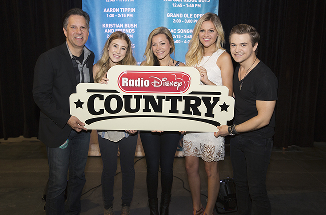 RADIO DISNEY - Radio Disney's Vice President, Programming and General Manager, Phil Guerini, was joined by some of country music's youngest rising stars Maddie & Tae (Dot Records), Kelsea Ballerini (Black River Entertainment) and Hunter Hayes (Atlantic Records) to help announce Radio Disney Country at CMA Fest on Friday, June 12. The modern, multi-platform country music-focused network for families launches this fall. (Disney Channel/Chris Hollo) PHIL GUERINI (VP, PROGRAMMING AND GENERAL MANAGER, RADIO DISNEY), MADDIE & TEA, KELSEA BALLERINI, HUNTER HAYES
