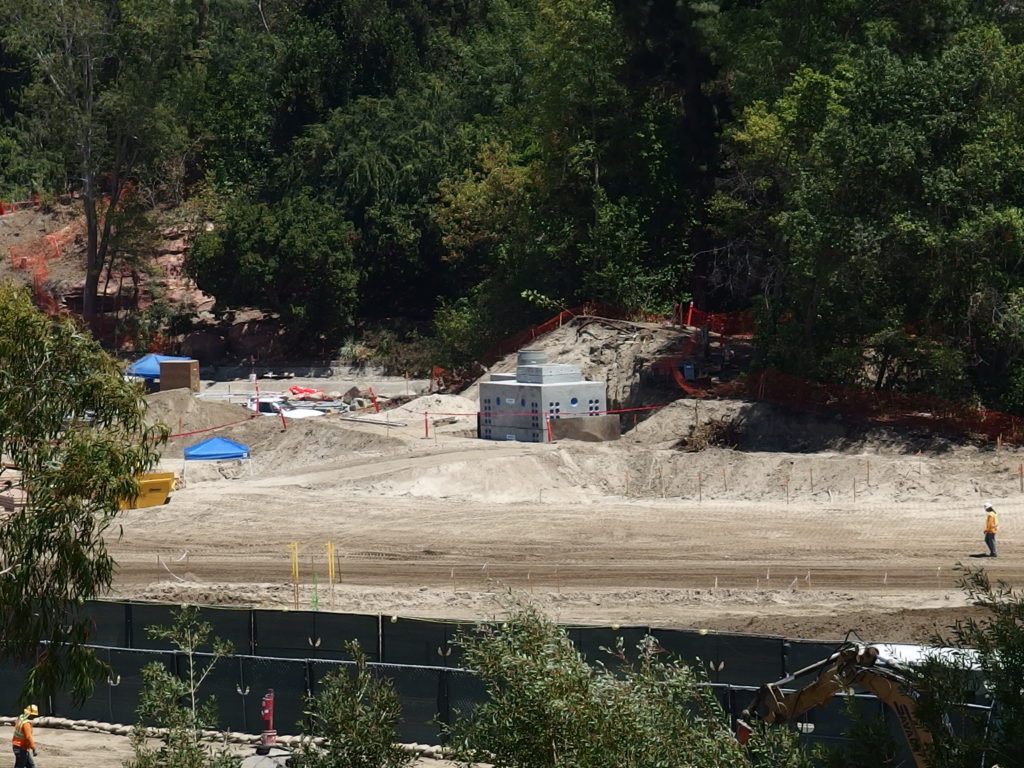 Small concrete structure appears to be a pump vault for a water feature along the re-routed Rivers of America