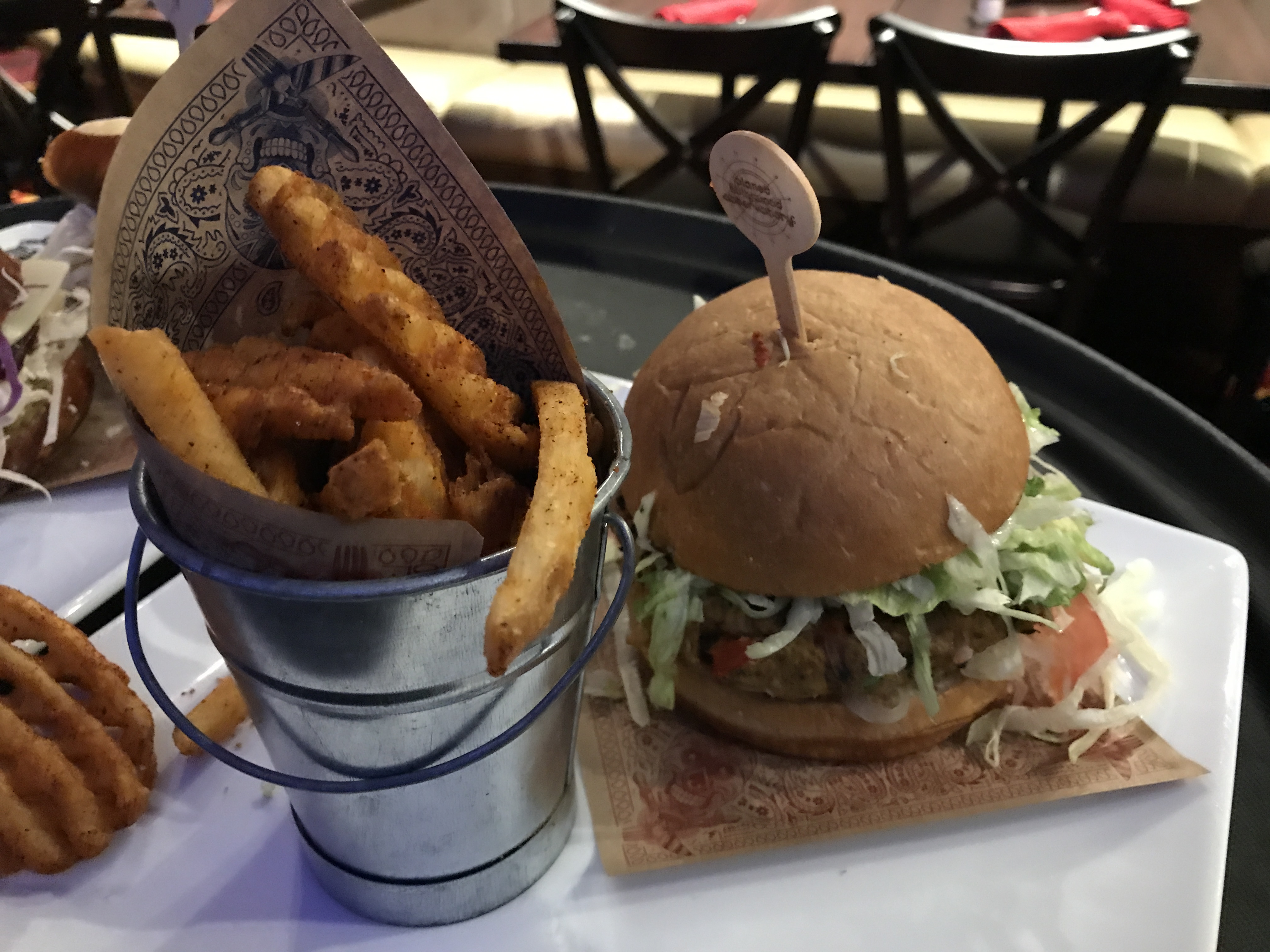 Bird is the Word - Crispy fried all-natural chicken breast, buttermilk ranch dressing, pickles, cheddar, slaw and honey hot sauce on a garlic-buttered brioche bun