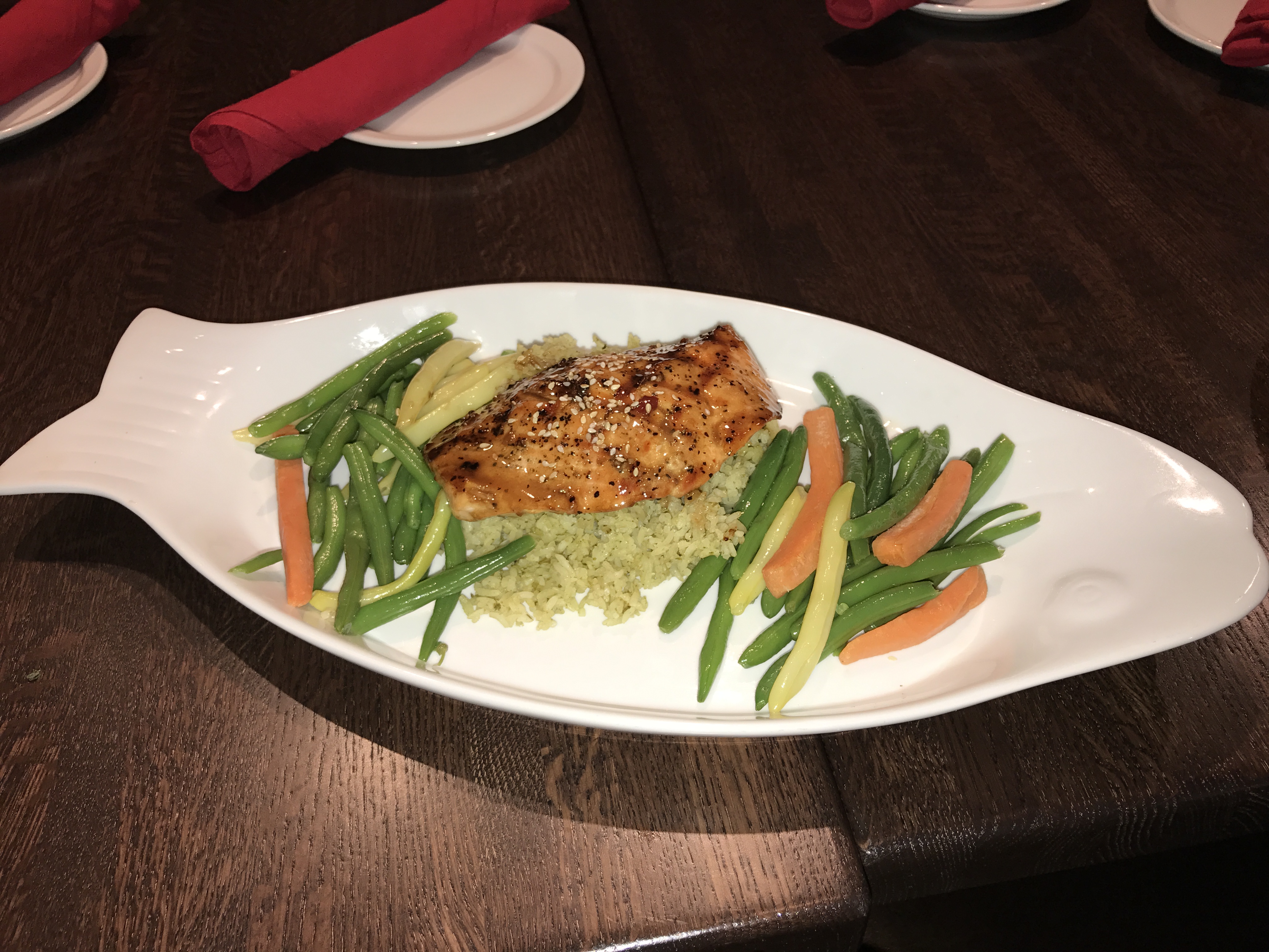 Sesame Ginger Salmon - Grilled soy-ginger glazed salmon, served with house-made cilantro rice and green bean blend