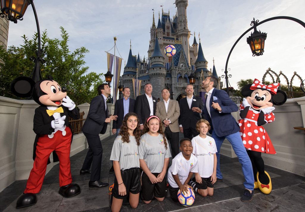 Officials from Disney Sports, LaLiga and IdeaSport LLC, posed with former LaLiga stars along with Mickey and Minnie and several youth soccer players at the Magic Kingdom