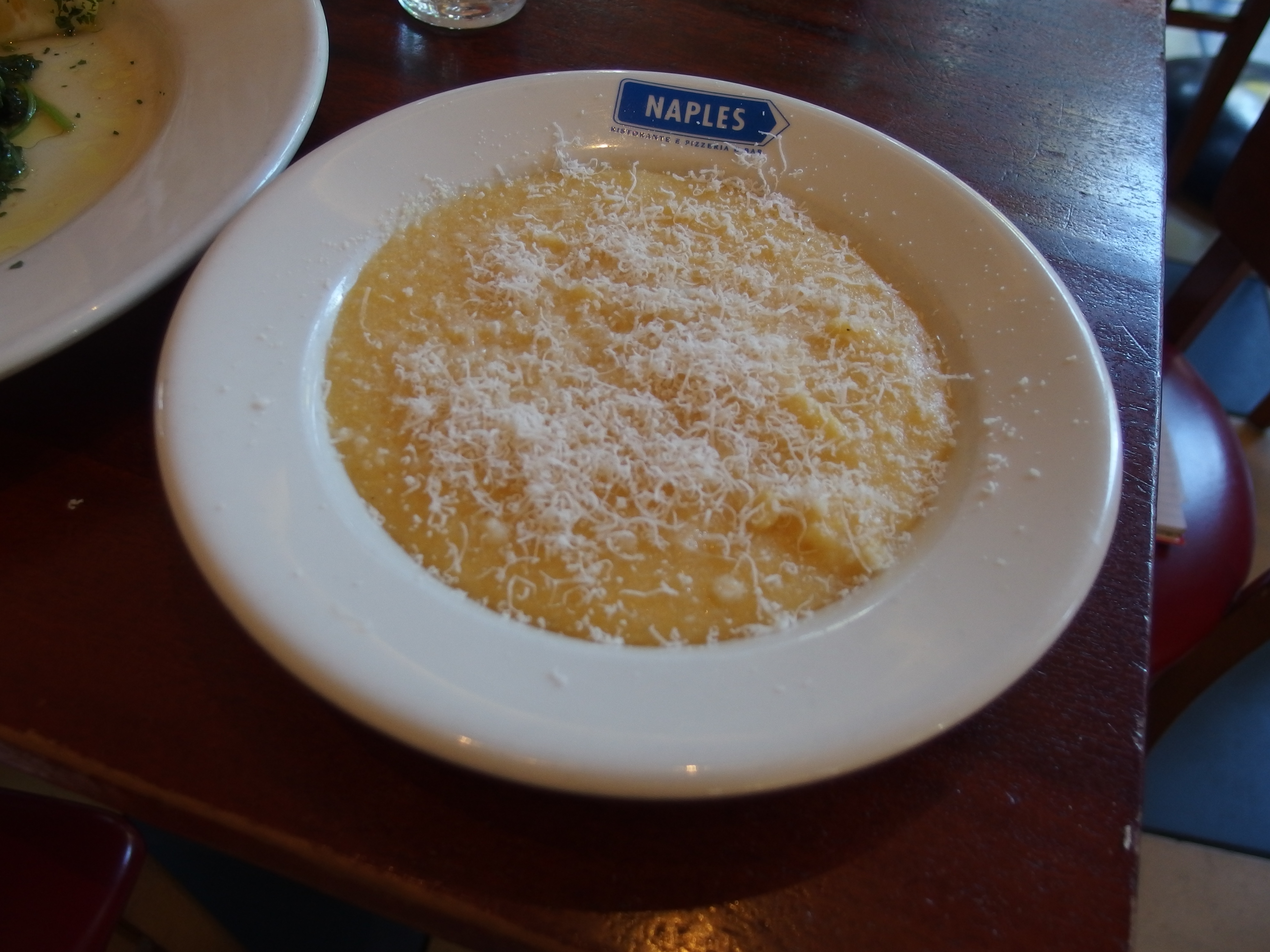 Polenta, embellished with freshly grated Parmesan