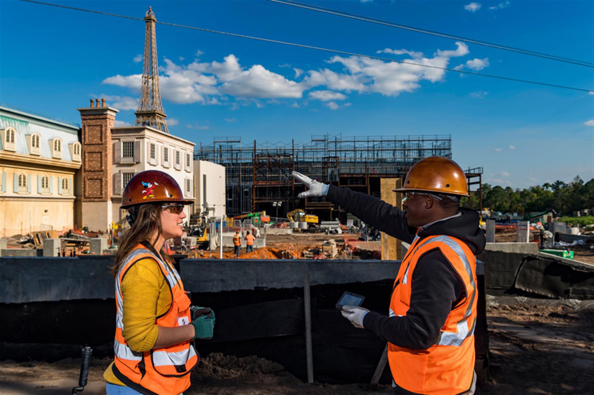 Imagineers overseeing construction near the entrance of Remy’s Ratatouille Adventure in the expanded France pavilion.