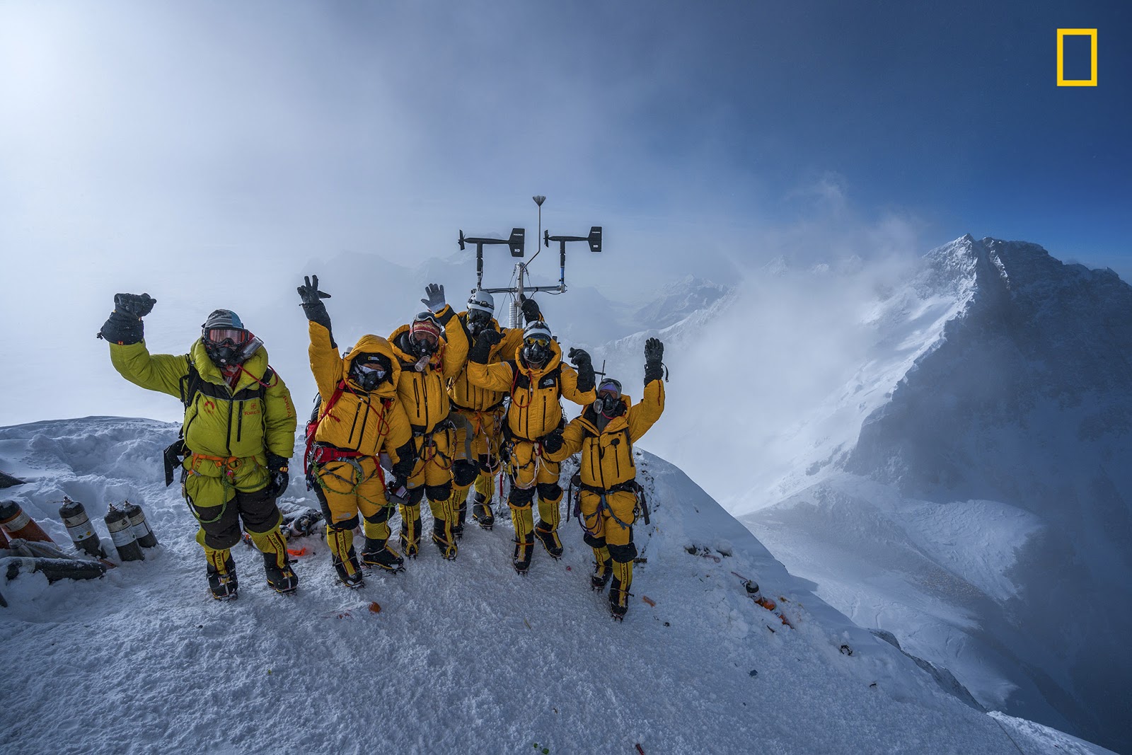 The team celebrates the success of their final weather station installation, which has already begun to send data back to a National Geographic server.PHOTOGRAPH BY MARK FISHER/NATIONAL GEOGRAPHIC