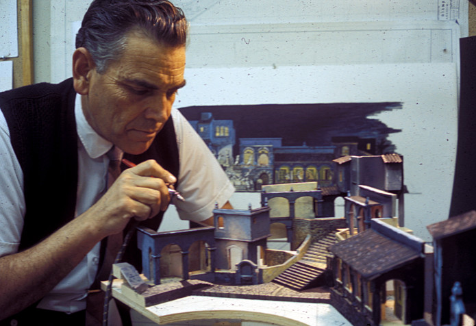 (Claude Coats airbrushing the Pirates attraction model.)