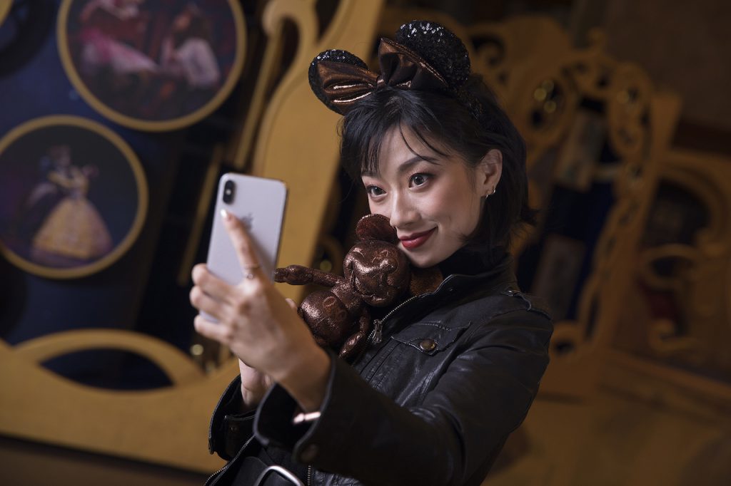 Actress Gloria Guo (“Belle” in the production) sporting the headwear in the lobby of the Grand Theatre