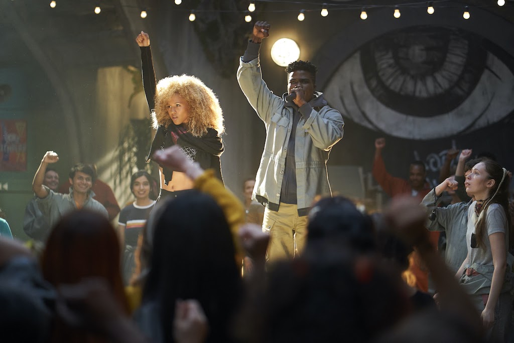 (L to R: Robyn Alomar (Aliyah) and Akiel Julien (Bohdi) perform “My Kin” (Boi-1da Ft. Nikhil Seetharam & The New Babyl Orchestra) for the citizens of New Babyl.  Photo Credit: Russ Martin)