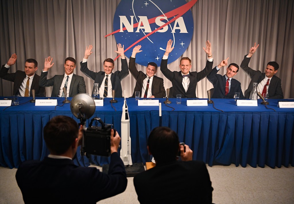 L to R: Micah Stock, Jake McDorman, Aaron Staton, Michael Trotter, Patrick J. Adams, Colin O'Donoghue, James Lafferty as Scott Carpenter (Credit: National Geographic/Gene Page)