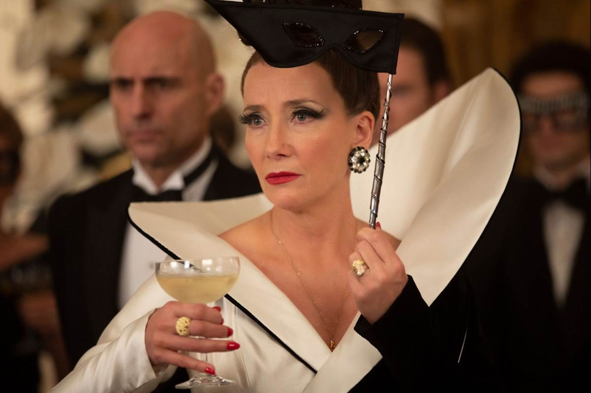 (L-R): Mark Strong as John the Valet and Emma Thompson as the Baroness in Disney’s live-action CRUELLA. Photo by Laurie Sparham. © 2021 Disney Enterprises, Inc. All Rights Reserved.