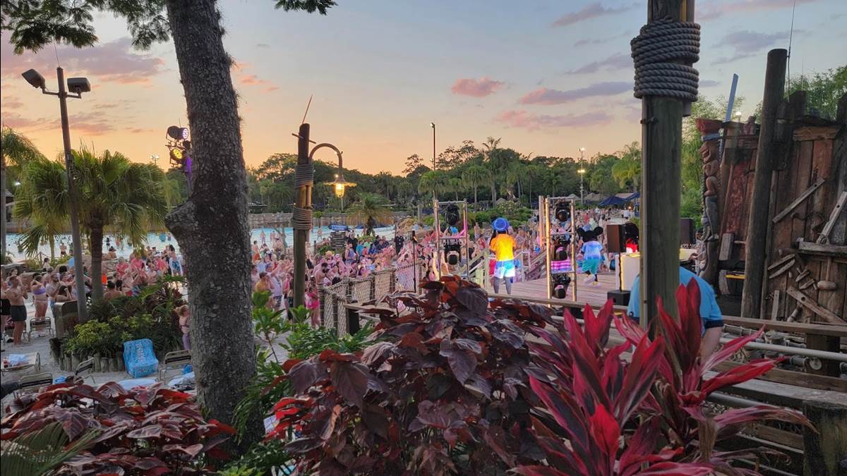 Goofy dances along with Mickey alongside the Typhoon Lagoon Surf Pool
