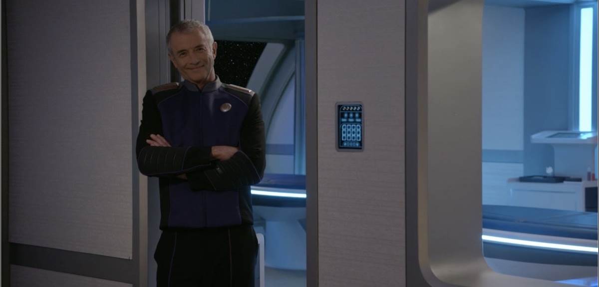 (Admiral Christie greets Dr. Finn after years apart)