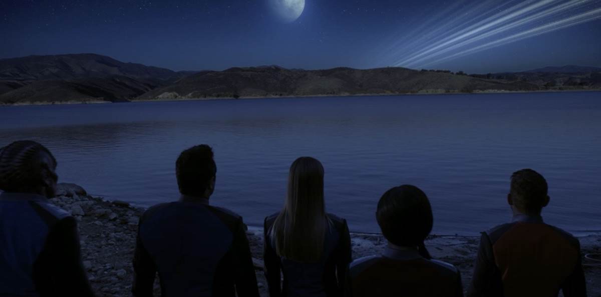 The crew stares out at a lake that looks just like one on Xelaya