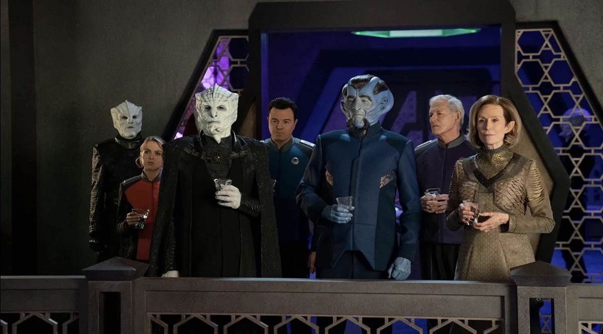 Korin stands with President Alcuzan and shows his guest the view of the Krill city below.