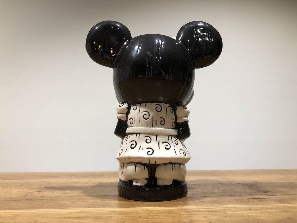 Back view; notice her heels!