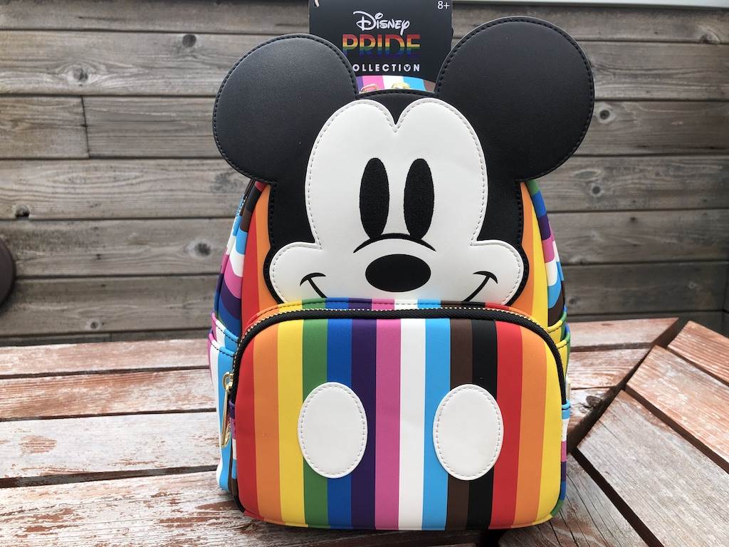 Mickey looks so cute, and I love the button detail on the front pouch.