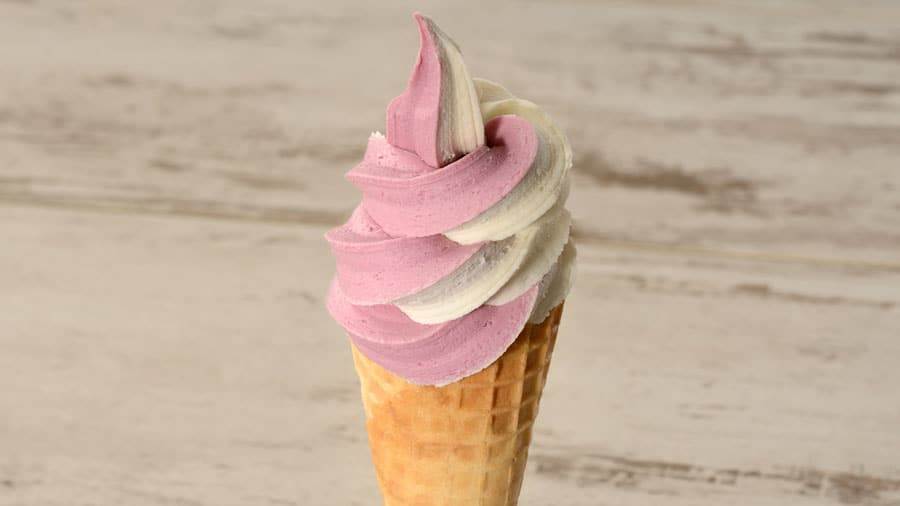 DOLE Whip cherry and vanilla swirl on a cone