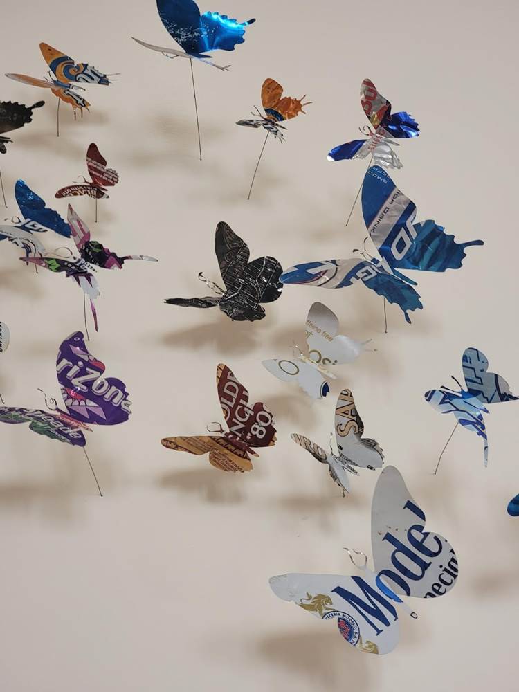 Unsure of the artist behind this display but I adore the repurposed aluminum beverage cans carrying the butterfly imagery from the Queen’s Room.