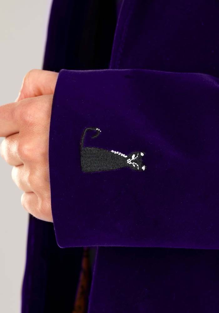 Binx the cat hides on the cuff.