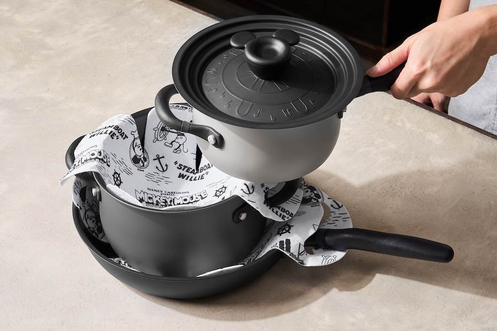 The set also comes with pan protectors decorated with Steamboat Willie