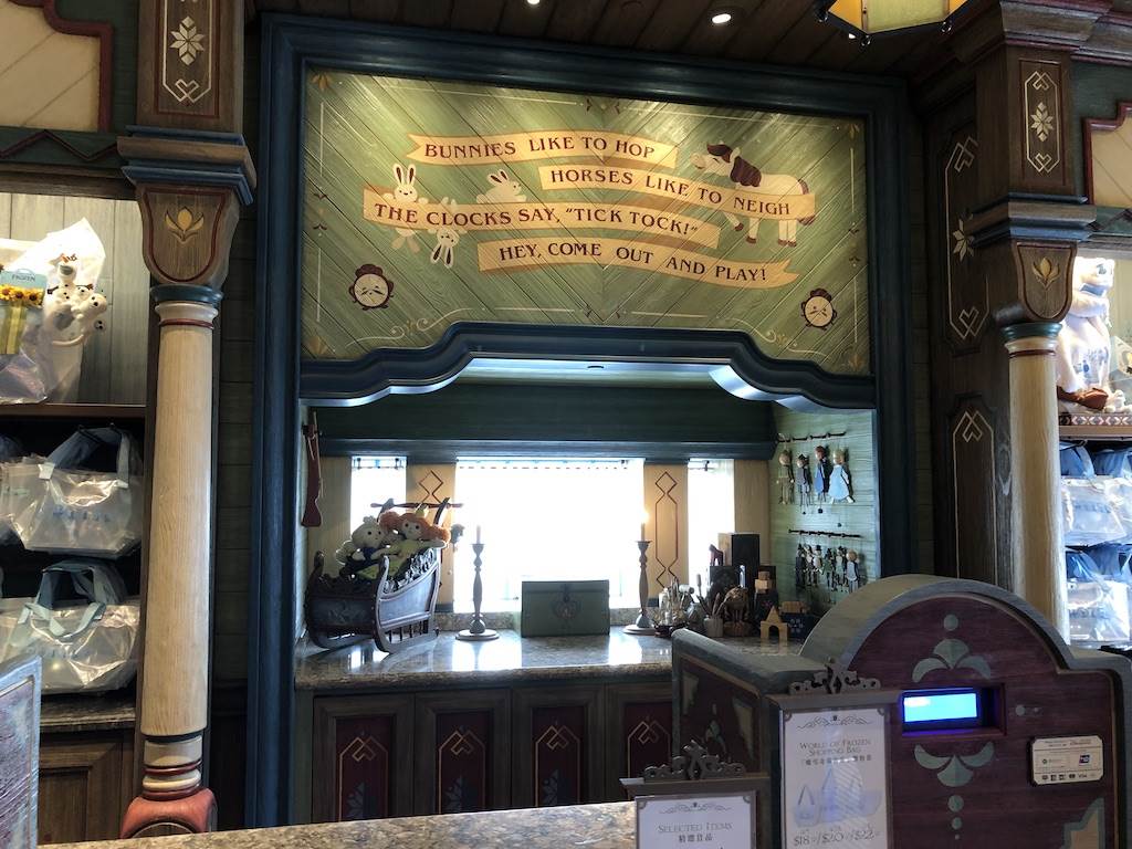 Wooden puppets decorate the side wall at chekout.