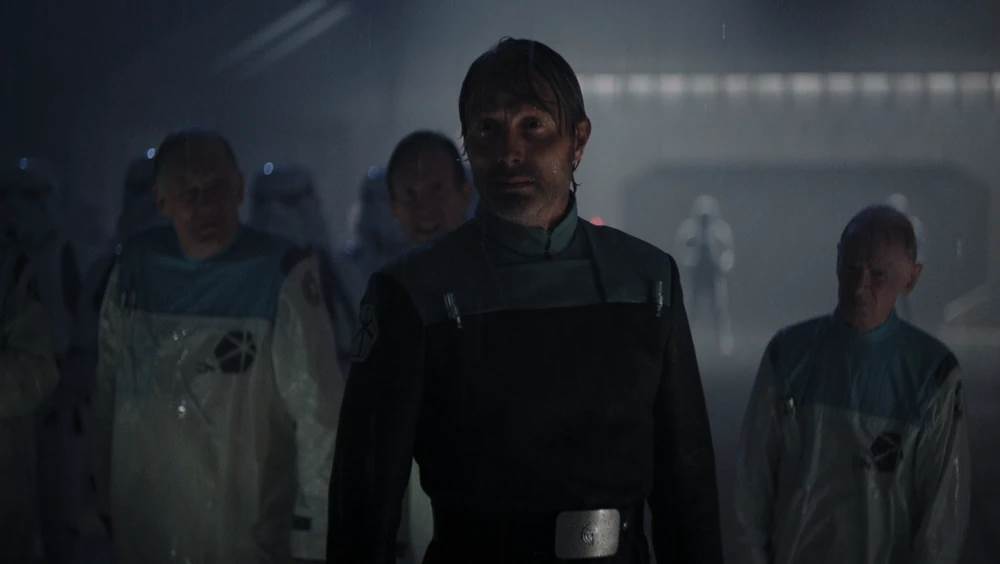 Franklin can be seen to the left of Mads Mikkelsen's Galen Erso