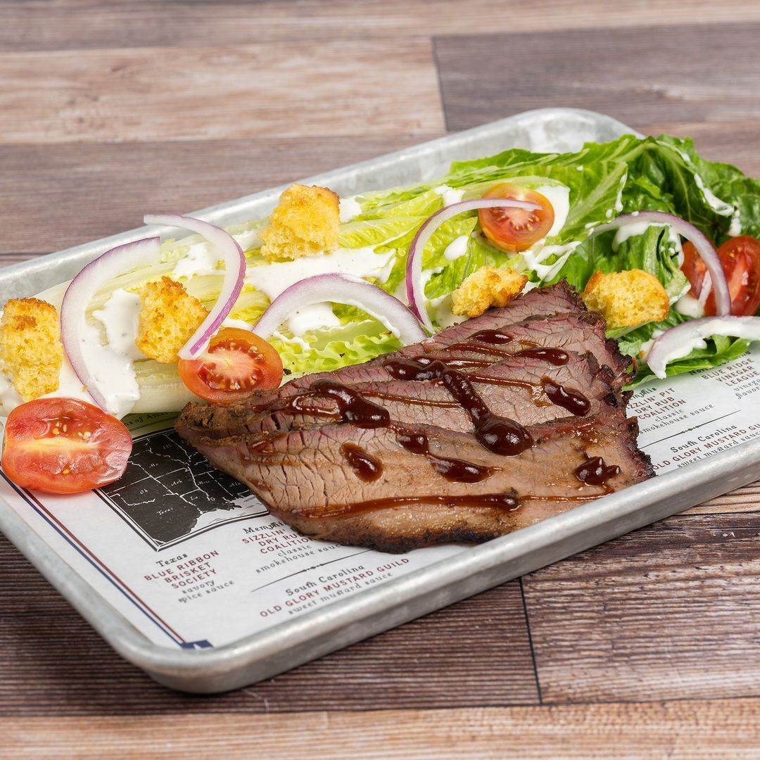 Photo by Disney Eats on June 18, 2024. May be an image of salad and steak.