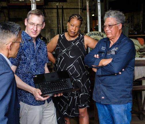 Imagineers Charita Carter, Dustin Eshenroder and Ted Robledo visit with local blacksmith Darryl Reeves in Louisiana