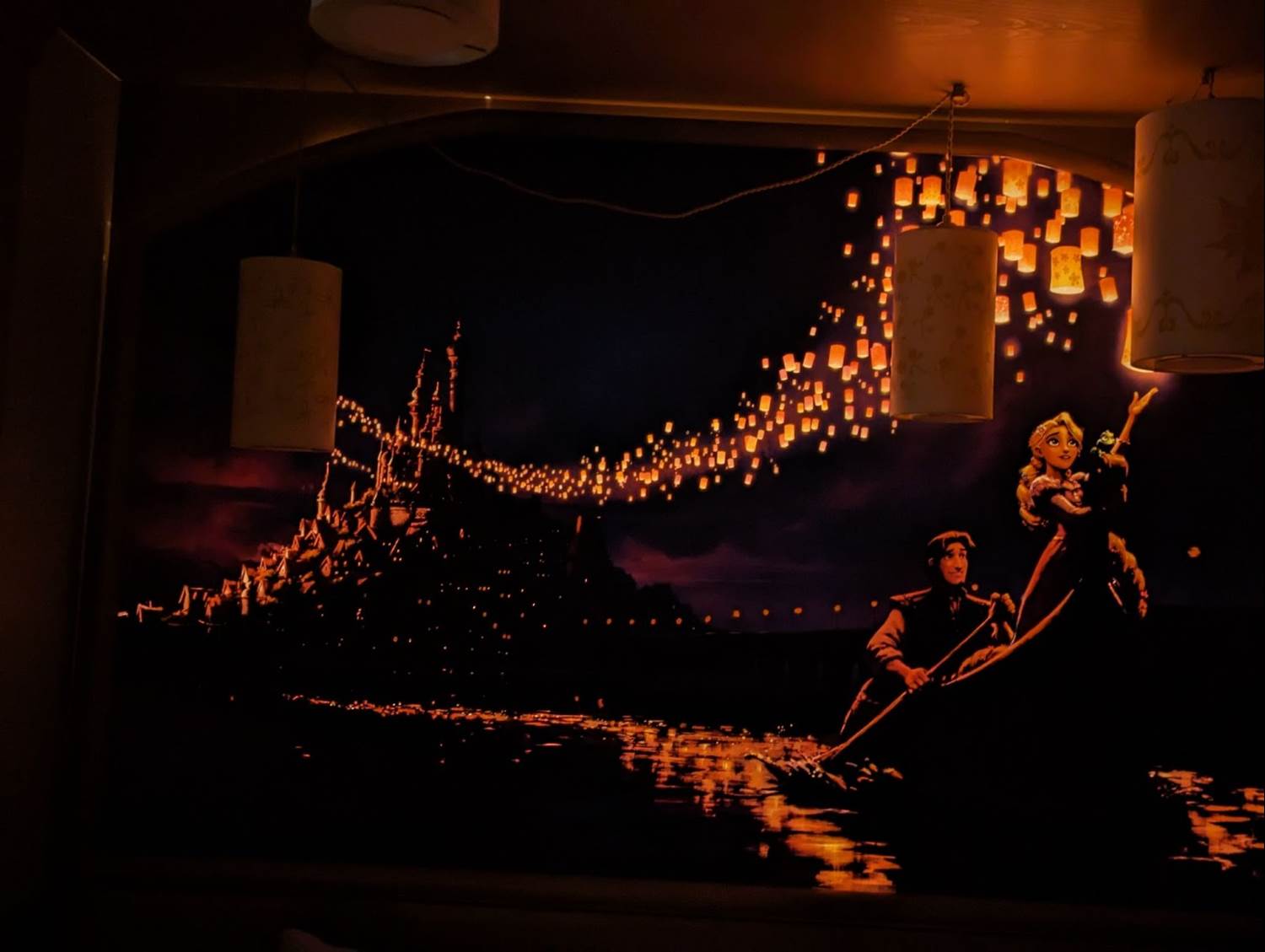 Above the sitting room sofa the painting of Rapunzel and Flynn (Thanks to the Vaca Family)